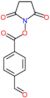 4-{[(2,5-dioxopyrrolidin-1-yl)oxy]carbonyl}benzaldehyde
