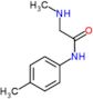 N-methyl-2-[(4-methylphenyl)amino]-2-oxoethanaminium