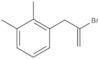 1-(2-Bromo-2-propen-1-yl)-2,3-dimethylbenzene