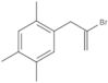 1-(2-Bromo-2-propen-1-yl)-2,4,5-trimethylbenzene