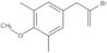 5-(2-Bromo-2-propen-1-yl)-2-methoxy-1,3-dimethylbenzene