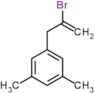 1-(2-bromoprop-2-en-1-yl)-3,5-dimethylbenzene