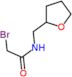 2-bromo-N-(tetrahydrofuran-2-ylmethyl)acetamide