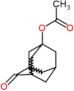 4-oxotricyclo[3.3.1.1~3,7~]dec-1-yl acetate