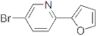 5-Bromo-2-(2-furanyl)pyridine