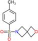 6-[(4-metilfenil)sulfonil]-2-oxa-6-azaspiro[3.3]heptano