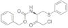 Carbamato di fenilmetile N-[(1R)-3-cloro-2-osso-1-[(feniltio)metil]propil]