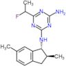 N2-[(1R,2S)-2,6-dimethylindan-1-yl]-6-(1-fluoroethyl)-1,3,5-triazine-2,4-diamine