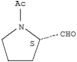 2-Pyrrolidinecarboxaldehyde,1-acetyl-, (2S)-