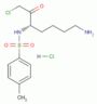 (3S)-1-Chloro-3-tosylamido-7-amino-2-heptanone hydrochloride