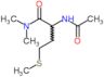 N~2~-acetyl-N,N-dimethylmethioninamide