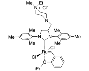 [1,3-Bis(2,4,6-trimethylphenyl)-4-[(4-ethyl-4-methylpiperazin-1-ium-1-yl)methyl]imidazolidin-2-ylidene]-(2-i-propoxybenzylidene)dichlororuthenium(II) chloride AquaMet