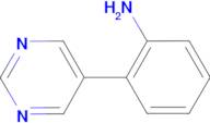 2-(5-Pyrimidinyl)aniline