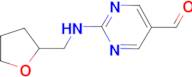 2-[(tetrahydrofuran-2-ylmethyl)amino]pyrimidine-5-carbaldehyde