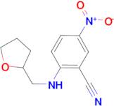 5-nitro-2-[(tetrahydrofuran-2-ylmethyl)amino]benzonitrile