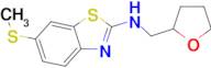 6-(methylthio)-N-(tetrahydrofuran-2-ylmethyl)-1,3-benzothiazol-2-amine