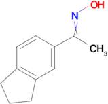 1-(2,3-dihydro-1H-inden-5-yl)ethan-1-one oxime