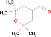 2,2,6,6-tetramethyloxane-4-carbaldehyde