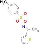 (E)-[1-(thiophen-2-yl)ethylidene]amino 4-methylbenzene-1-sulfonate