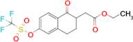 Ethyl 2-(1-oxo-6-(((trifluoromethyl)sulfonyl)oxy)-1,2,3,4-tetrahydronaphthalen-2-yl)acetate