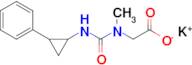 Potassium 2-{methyl[(2-phenylcyclopropyl)carbamoyl]amino}acetate