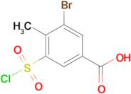 3-Bromo-5-(chlorosulfonyl)-4-methylbenzoic acid