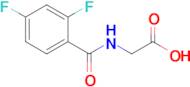 2-[(2,4-difluorophenyl)formamido]acetic acid