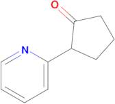 2-(Pyridin-2-yl)cyclopentan-1-one