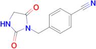 4-[(2,5-dioxoimidazolidin-1-yl)methyl]benzonitrile