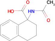 1-Acetamido-1,2,3,4-tetrahydronaphthalene-1-carboxylic acid