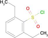 2,6-Diethylbenzene-1-sulfonyl chloride