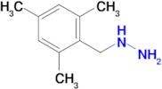 (2,4,6-Trimethylbenzyl)hydrazine