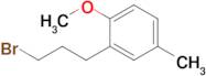 2-(3-Bromopropyl)-1-methoxy-4-methylbenzene