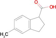 5-Methyl-2,3-dihydro-1H-indene-1-carboxylic acid