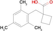 1-(2,4,6-Trimethylbenzyl)cyclobutane-1-carboxylic acid