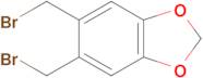 5,6-Bis(bromomethyl)benzo[d][1,3]dioxole