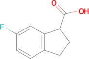 6-Fluoro-2,3-dihydro-1H-indene-1-carboxylic acid