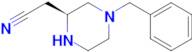 (S)-2-(4-Benzylpiperazin-2-yl)acetonitrile
