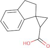 2',3'-Dihydrospiro[cyclopropane-1,1'-indene]-3-carboxylic acid