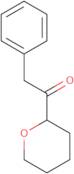 1-(Oxan-2-yl)-2-phenylethan-1-one