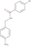 N-[(4-Aminophenyl)methyl]-4-bromobenzamide