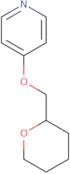4-(Oxan-2-ylmethoxy)pyridine