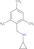 N-[(2,4,6-Trimethylphenyl)methyl]cyclopropanamine