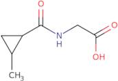 2-[(2-Methylcyclopropyl)formamido]acetic acid