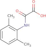 [(2,6-Dimethylphenyl)amino](oxo)acetic acid