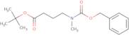 tert-Butyl 4-{[(benzyloxy)carbonyl](methyl)amino}butanoate