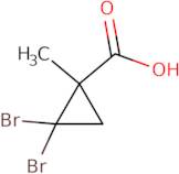 2,2-Dibromo-1-methylcyclopropanecarboxylic acid