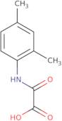 [(2,4-Dimethylphenyl)amino](oxo)acetic acid