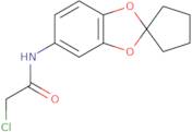 2-Chloro-N-{spiro[1,3-dioxaindane-2,1'-cyclopentane]-6-yl}acetamide