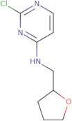 2-Chloro-N-[(oxolan-2-yl)methyl]pyrimidin-4-amine